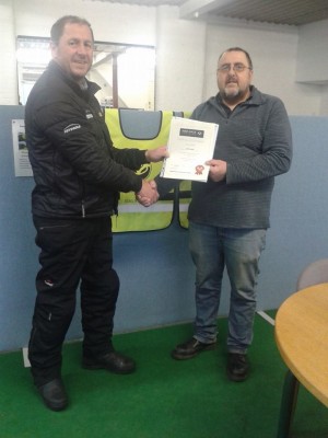 Mick with his new Inner Circle Direct Access course completion certificate, awarded after he passed his full bike test first time!