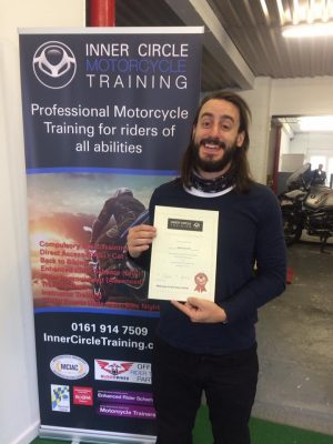 Adam all smiles as he passes his bike test!